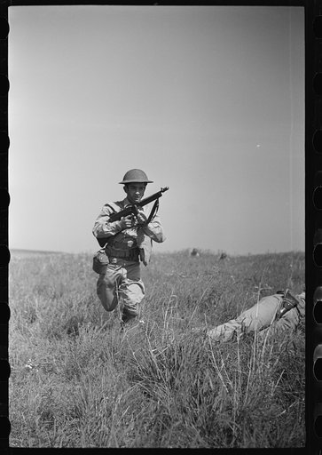 Fort Riley, Kansas. Soldiers of a mechanized reconnaissance unit during a simulated dismounted attack