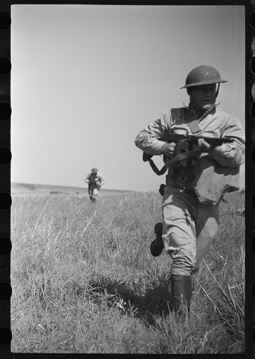 Fort Riley, Kansas. Soldiers of a mechanized reconnaissance unit during a simulated dismounted attack