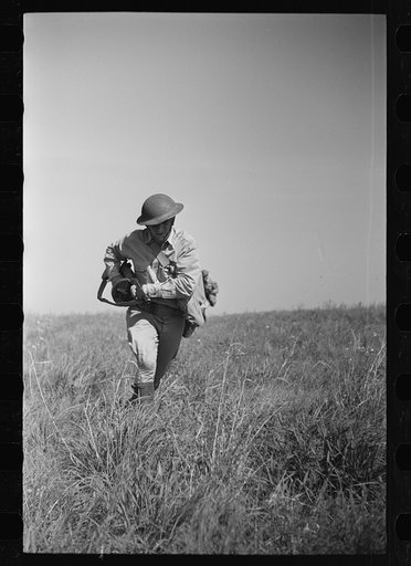 Fort Riley, Kansas. Soldiers of a mechanized reconnaissance unit during a simulated dismounted attack