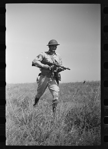 Fort Riley, Kansas. Soldiers of a mechanized reconnaissance unit during a simulated dismounted attack