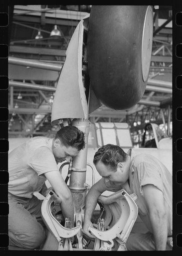 Nashville, Tennessee. Vultee Aircraft Company. Working on the landing gear of a bomber