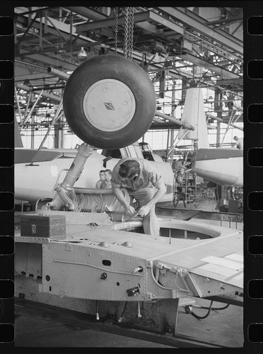 Nashville, Tennessee. Vultee Aircraft Company. Working on the landing gear of a bomber
