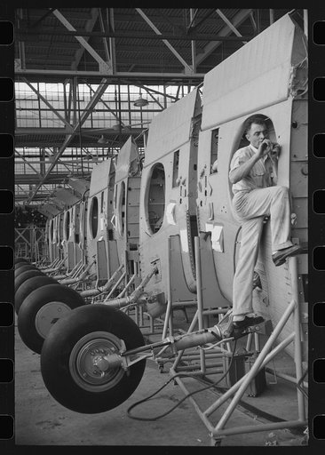 Nashville, Tennessee. Vultee Aircraft Company. Installing landing gear on wing parts in a sub-assembly section