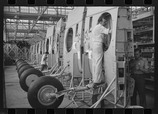 Nashville, Tennessee. Vultee Aircraft Company. Installing landing gear on wing parts in a sub-assembly section