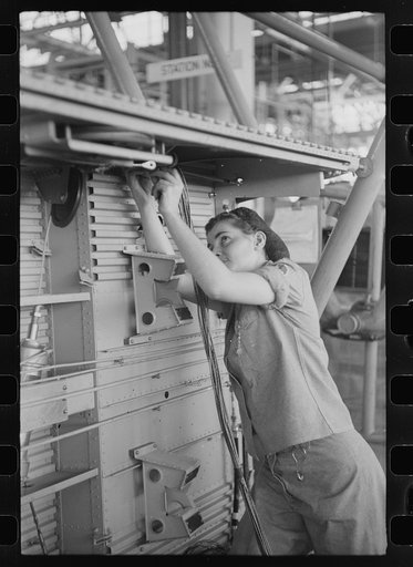Nashville, Tennessee. Vultee Aircraft Company. Installing electric wiring in a fuselage
