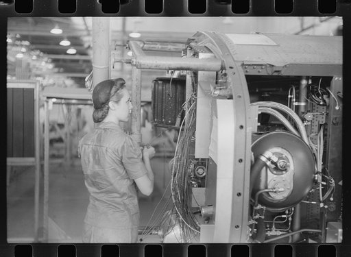 Nashville, Tennessee. Vultee Aircraft Company. Installing electric wiring in a fuselage