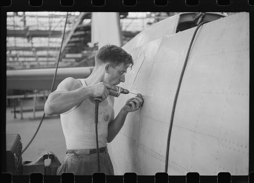 Nashville, Tennessee. Vultee Aircraft Company. Drilling holes for rivets in a fuselage on a sub-assembly line