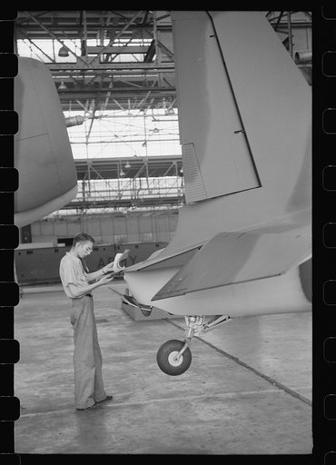 Nashville, Tennessee. Vultee Aircraft Company. Checking records on the final assembly line