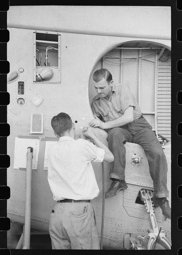 Nashville, Tennessee. Vultee Aircraft Company. Installing landing gear on wing parts in a sub-assembly section