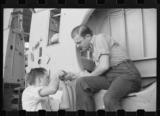 Nashville, Tennessee. Vultee Aircraft Company. Installing landing gear on wing parts in a sub-assembly section