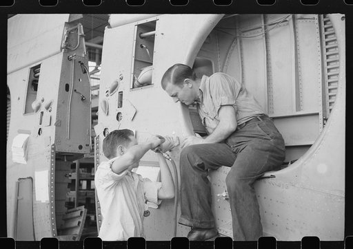 Nashville, Tennessee. Vultee Aircraft Company. Installing landing gear on wing parts in a sub-assembly section