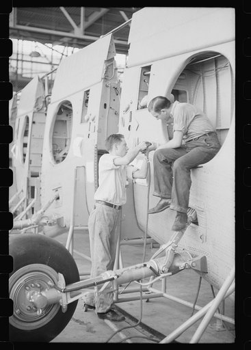 Nashville, Tennessee. Vultee Aircraft Company. Installing landing gear on wing parts in a sub-assembly section