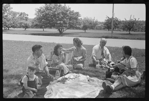 Washington, D.C. Group of gardeners from the Fair Lawn avenue victory gardens eating a picnic lunch beside the Anacostia River after a morning spent working on their plots
