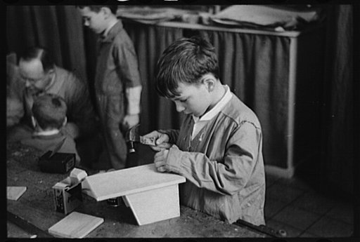 Wilmington, Delaware. Tower Hill School, noted country day school for pupils from three to eighteen years of age. Small boys and an instructor in a woodcraft class