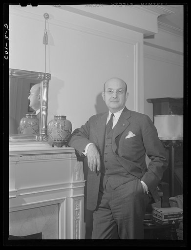 Assistant Secretary of War Louis A. Johnson(?) photographed in his home. Washington, D.C.