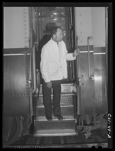 Untitled photo, possibly related to: Alfred MacMillian, Pullman porter waiting for train to start aboard the "Capitol Limited" bound for Chicago, Illinois