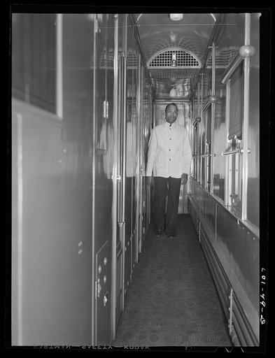 Mr. Alfred MacMillan, pullman porter, going to answer a call aboard the "Capitol Limited" bound for Chicago, Illinois