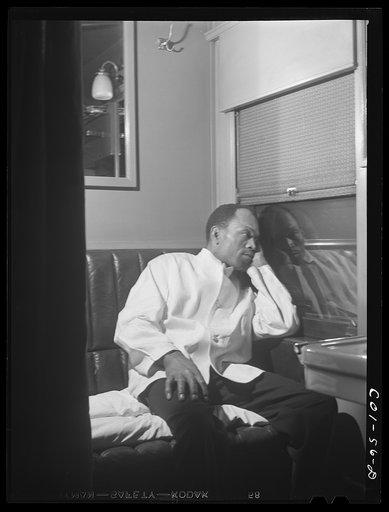 Alfred MacMillan, Pullman porter resting in the men's washroom aboard the "Capitol Limited" bound for Chicago, Illinois