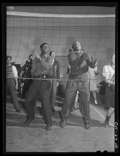 Young "Wellstowners" playing volleyball in the recreation hall at the community center of the Ida B. Wells Housing Project, Chicago, Illinois