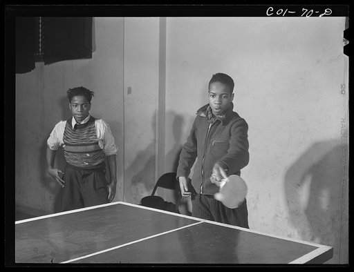 A game of ping-pong in the recreation hall at the community center. Ida B. Wells Housing Project, Chicago, Illinois