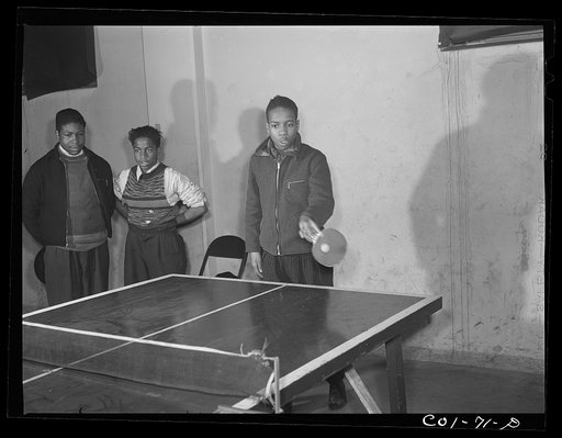 Untitled photo, possibly related to: A game of ping-pong in the recreation hall at the community center. Ida B. Wells Housing Project, Chicago, Illinois