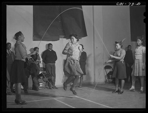 Skipping rope in the recreation hall at the community center. Ida B. Wells Housing Project, Chicago, Illinois