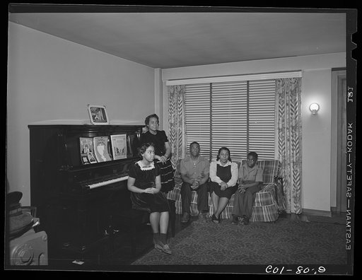 Untitled photo, possibly related to: The Carr family in their living room. Ida B. Wells Housing Project, Chicago, Illinois