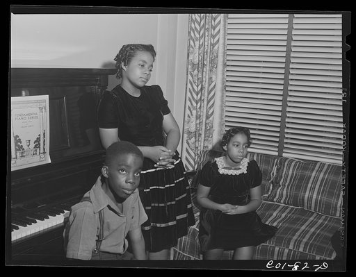 Untitled photo, possibly related to: The Carr family in their living room. Ida B. Wells Housing Project, Chicago, Illinois