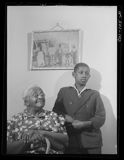 Mrs. Ella Patterson, the oldest resident at the Ida B. Wells Housing Project, Chicago, Illinois, and her grandson. She is 102 years old