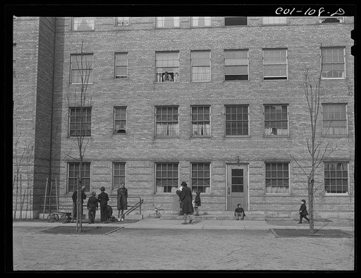 Children playing in one of the many courtyards. Ida B. Wells Housing Project, Chicago, Illinois