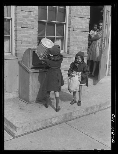 Untitled photo, possibly related to: Children dumping garbage into one of the incinerators. Ida B. Wells Housing Project, Chicago, Illinois