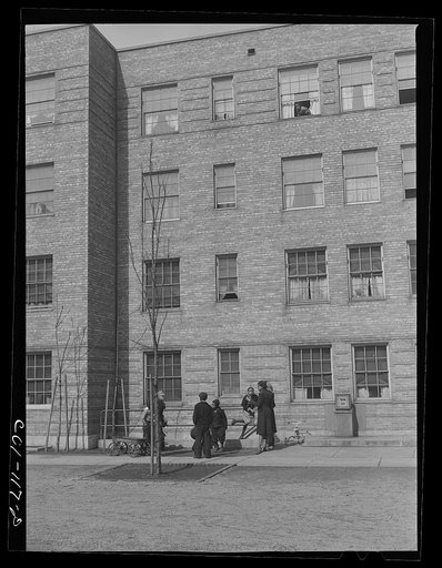 Children playing in one of the many courtyards. Ida B. Wells Housing Project, Chicago, Illinois