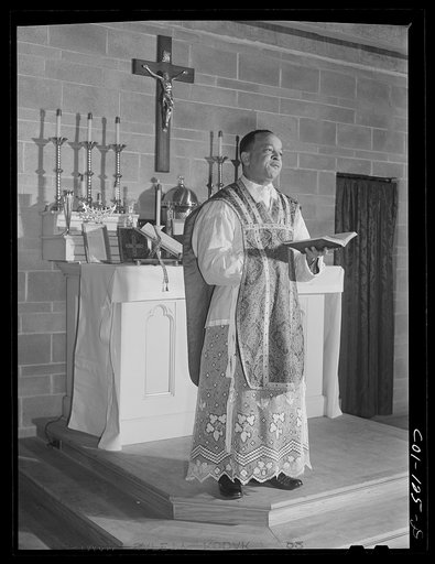 Untitled photo, possibly related to: Father Smith, Negro pastor, conducting Sunday Mass at a Negro Catholic church service on the South Side. Chicago, Illinois
