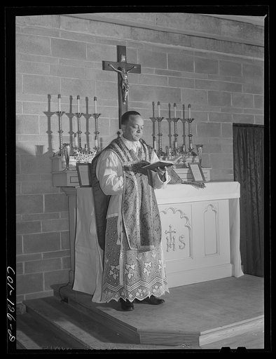 Father Smith, Negro pastor, conducting Sunday Mass at a Negro Catholic church service on the South Side. Chicago, Illinois