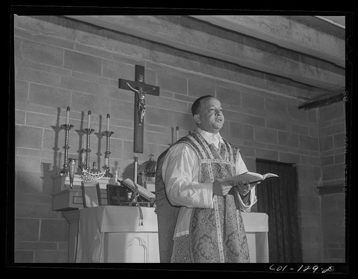 Untitled photo, possibly related to: Father Smith, colored pastor, preaching a sermon at a Negro Catholic church service on the South Side of Chicago, Illinois