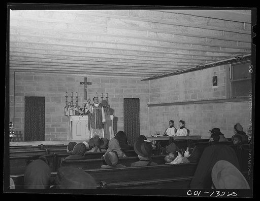Father Smith, colored pastor, conducting Mass at a Negro Catholic church service on the South Side of Chicago, Illinois