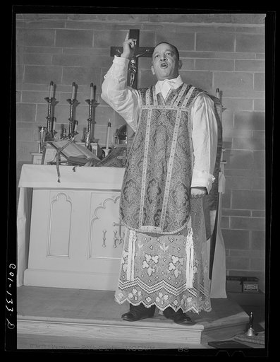 Father Smith, colored pastor, preaching a sermon at a Negro Catholic church service on the South Side of Chicago, Illinois