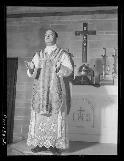 Father Smith, colored pastor, conducting Mass at a Negro Catholic Church service on the South Side. Chicago, Illinois