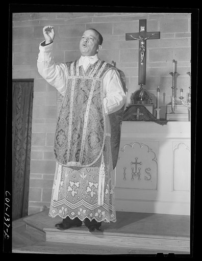 Untitled photo, possibly related to: Father Smith, colored pastor, conducting Mass at a Negro Catholic church service on the South Side. Chicago, Illinois