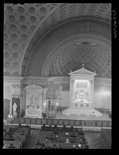 Untitled photo, possibly related to: Sunday Mass at the Corpus Christi Catholic church. The pastor, Father Refinus, is white, but ninety-eight percent of the population is colored. The total church membership is over 2,000. Chicagi, Illinois