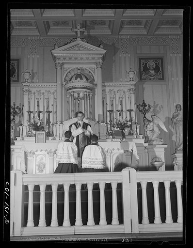 Sunday Mass at Saint Elizabeth's Catholic church. All the pastors here are white with the exception of Father Smith, who was shown conducting services at another church. The congregation is entirely colored. Chicago, Illinois