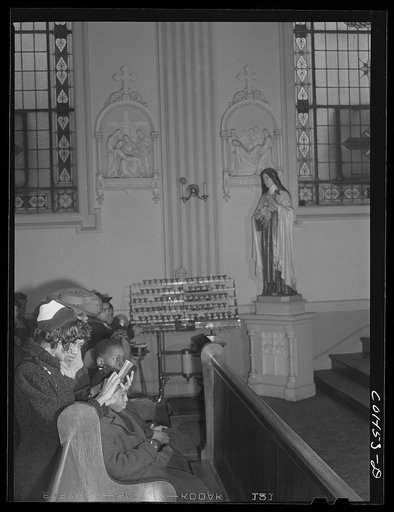 Sunday Mass at Saint Elizabeth's Catholic church. All the pastors here are white with the exception of Father Smith. The congregation is entirely colored. Chicago, Illinois