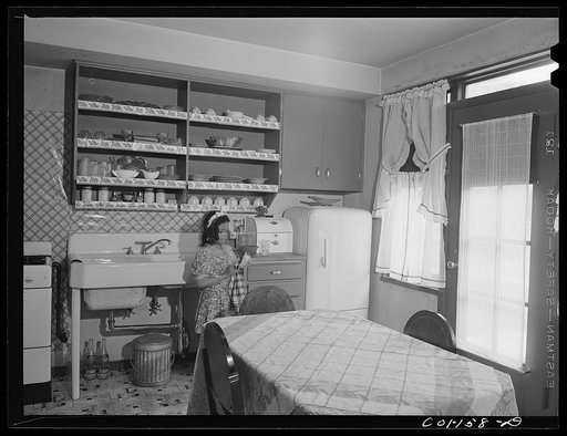 Untitled photo, possibly related to: Rosemary Merchant washing dishes after dinner. Mr. and Mrs. Frank Merchant have a two-floor apartment--five rooms including kitchen and bath. Mr. Merchant works at the Carnegie Steel Company's South Chicago plant. They have three children: Frank, eight; Rosemary,
