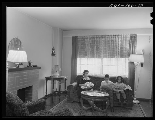 Mrs. Frank Merchant and her children. They have a two-floor apartment--five rooms including kitchen and bath. Mr. Merchant works at the Carnegie Steel Company's South Chicago plant. They have three children: Frank, eight; Rosemary, eight; and baby, four months old. Ida B. Wells Housing Project, Chic