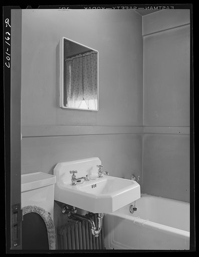 Bathroom in the Merchant's apartment. Two floors--five rooms including kitchen and bath. Mr. Merchant works at the Carnegie Steel Company's South Chicago plant. They have three children: Frank, eight; Rosemary, eight; and baby fiur months old. Ida B. Wells Housing Project, Chicago, Illinois