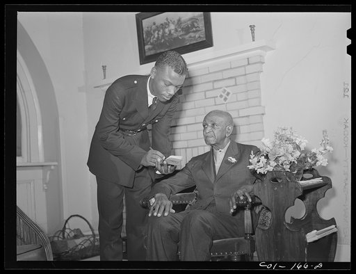 Untitled photo, possibly related to: Tuskegee Institute, Alabama. Dr. George Washington Carver talks to members of Reserve Officers Training Corps