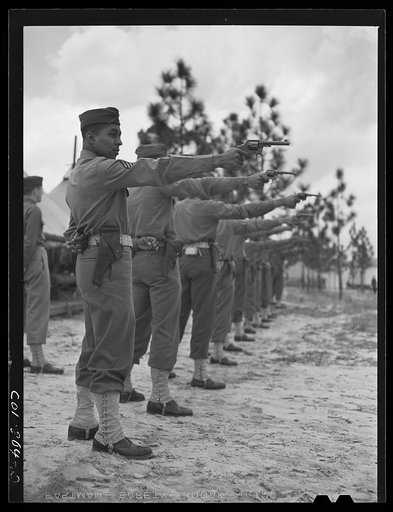 Untitled photo, possibly related to: Fort Bragg, North Carolina. Sergeant Franklin Williams with 41st Engineers at pistol practice