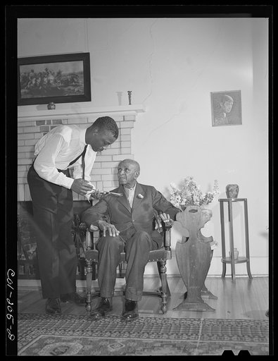 Untitled photo, possibly related to: Tuskegee Institute, Alabama. Dr. George Washington Carver talks to members of Reserve Officers Training Corps