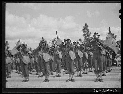 Untitled photo, possibly related to: Fort Bragg, North Carolina. Gas mask drill, Company J, 41st Engineers
