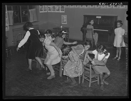 Chicago, Illinois. Ida B. Wells Housing Project. Children playing a game in a music class